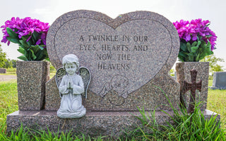 a headstone that says, "a twinkle in our eyes, hearts, and now, the heavens"