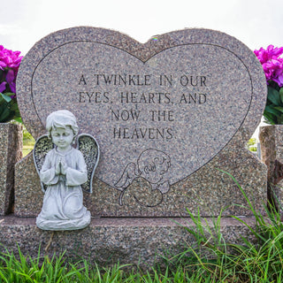 a headstone that says, "a twinkle in our eyes, hearts, and now, the heavens"