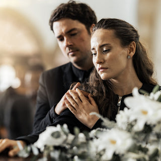 couple at a funeral wake