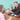 woman and funeral planner sitting at a table with a plaque and urn