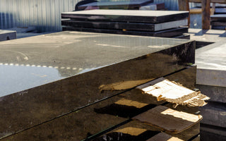 Marble and granite slabs for making tombstones in a warehouse