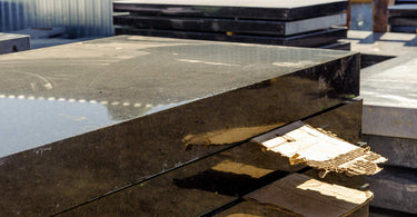 Marble and granite slabs for making tombstones in a warehouse